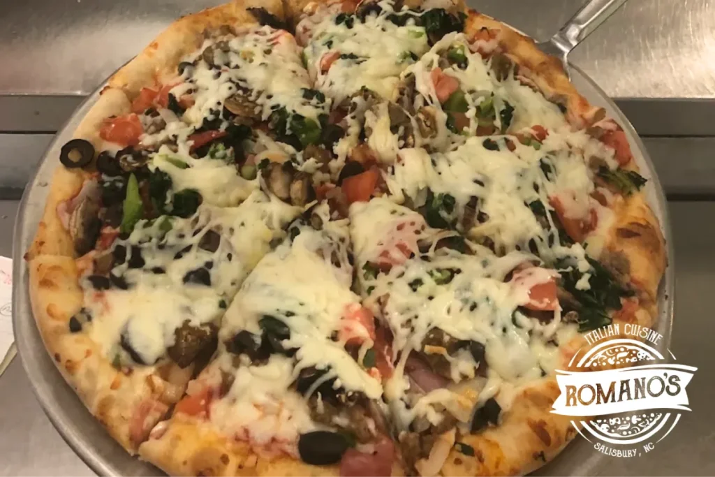Fresh vegetable pizza with melted cheese and toppings.
